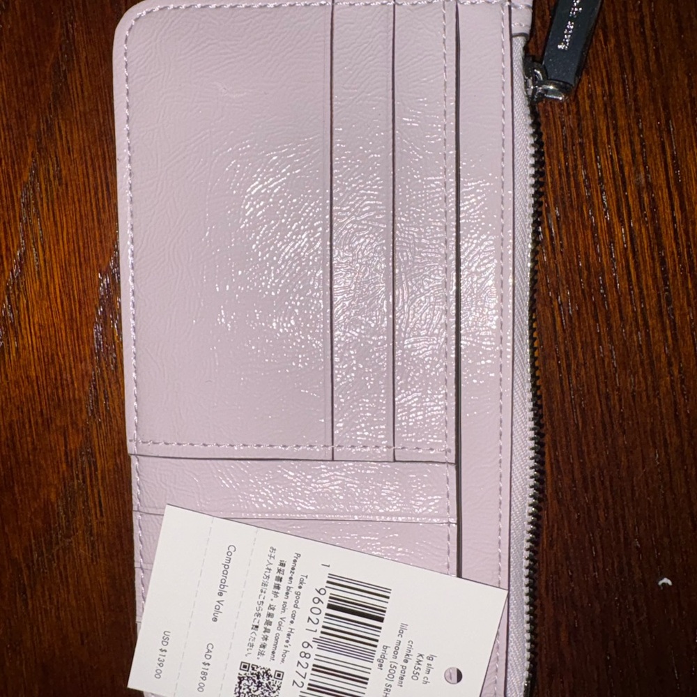 kate spade pale pink zip-around wallet